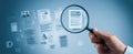 The magnifying glass revealing detailed documents in a digital workspace. AI generated image Royalty Free Stock Photo