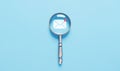 magnifying glass shows an icon for new email, sending an information message email from the tablet. smart SMS mail on digital. Royalty Free Stock Photo