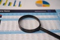 Magnifying glass on spreadsheet charts graphs paper. Financial development, Banking Account, Statistics, Investment Analytic Royalty Free Stock Photo