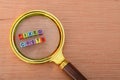 Magnifying glass with text FIXED COSTS. Fixed cost is a business expense that does not change regardless of the activity level of Royalty Free Stock Photo