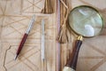 Magnifying Glass And Two Pens On Leather Folder Royalty Free Stock Photo