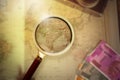 Magnifying glass on vintage retro India map and currency. Vintage camera on antique Indian map