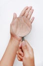 Magnifying glass on woman hand against white background Royalty Free Stock Photo