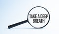 Magnifying glass with the word Take a deep breath. Business concept