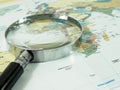 Magnifying glass on world map Royalty Free Stock Photo