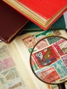 Magnifying glass and world postage stamps