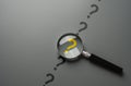 Magnifying glass and yellow question mark. FAQ.