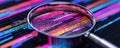 Magnifying Glass Zooming into Colorful Data Visualization Royalty Free Stock Photo