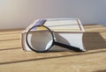 Magnifying lens with close thick book for study and reading