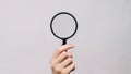 Magnifying loupe searching lens woman hand zooming Royalty Free Stock Photo