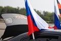 Magnitogorsk, Russia, - August, 22, 2014. Passenger car with Russian and St. George flags on the streets of the city Royalty Free Stock Photo