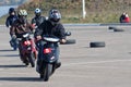 Magnitogorsk, Russia, - September, 28, 2014. Young members of the club of fans of scooters hold training races on the open urban