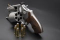 .44 magnum revolver hand gun with ammunition on black background Royalty Free Stock Photo