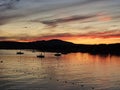 Magog Memphremagog Lake mountains orange red sky sunset Quebec Royalty Free Stock Photo