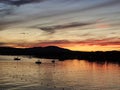 Magog Memphremagog Lake mountains orange red sky sunset Quebec Royalty Free Stock Photo