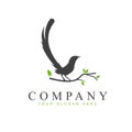 magpie silhouette logo design perching on a tree branch vector Royalty Free Stock Photo