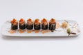 Maguro Maki Sushi Topping with Maguro Bluefin Tuna with Sauce and Ebiko Shrimp Egg Served with Wasabi and Prickled Ginger Royalty Free Stock Photo