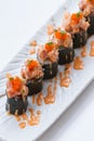 Maguro Maki Sushi Topping with Maguro Bluefin Tuna with Sauce and Ebiko Shrimp Egg Served with Wasabi and Prickled Ginger Royalty Free Stock Photo