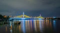 Maha Chesadabodindranusorn Bridge or Nonthaburi Bridge crossing Chao Phraya River and Bangkok skyline, Thailand. Urban city and Royalty Free Stock Photo