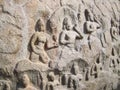 Mahabalipuram, Tamil Nadu, India - June 14, 2009 Ancient bas relief of Hindu deities on granite monolithic stone