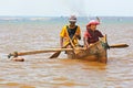 Malagasy family in a small rowing boat