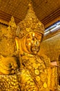Golden Buddha statue in the Mahamuni Buddha Temple, Mandalay, Myanmar