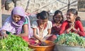 Indian girls selling vegetables at local market