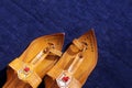 Maharashtrian Traditional Kolhapuri chappal on blue background Royalty Free Stock Photo