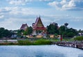 Mahasarakham Thailand - 27 November 2019: Man in red shirt was walking across the wooden bridge old. In order to Buddhist temples Royalty Free Stock Photo