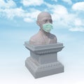 Mahatma Gandhi sculpture with surgeon mask