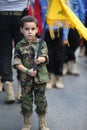 Mahdi Scouts Boys during With flags, pictures and religious slogans during Funeral of Hezbollah Royalty Free Stock Photo