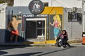 Entrance of a gym Planet Fitness with hand drawn cartoons