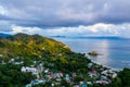 Mahe Island with Port Glaud village drone landscape, with lush tropical forest, Seychelles.