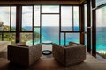 Mahe Seychelles , luxury swimming pool with chairs at the Four Season resort in the mountains La Digue tropical Island