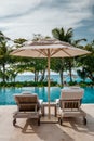 Mahe Seychelles , luxury swimming pool with chairs at the Four Season resort in the mountains La Digue tropical Island