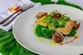 Mahi-mahi fillet and clams with broccoli and fresh herbs Royalty Free Stock Photo