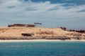 Mahmya island in red sea, Egypt, turquoise water, blue sky, boats and tourists in paradise. Holiday and travel concept