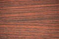 Mahogany, polished flat surface of natural red wood with a striped cut and close-up pattern Royalty Free Stock Photo