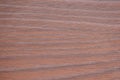 Mahogany, the texture of a natural dark wood with a rich pattern close-up Royalty Free Stock Photo