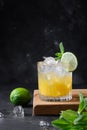 Mai Tai Classic rum cocktail. Tropical lemonade with lime on black. Vertical format. Royalty Free Stock Photo