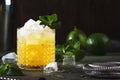 Mai Tai cocktail, refreshing drink with white rum, liqueur, sugar syrup, lime juice, mint and crushed ice. Dark background, bar Royalty Free Stock Photo