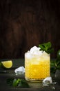 Mai Tai cocktail, refreshing drink with white rum, liqueur, sugar syrup, lime juice, mint and crushed ice. Dark background, bar Royalty Free Stock Photo