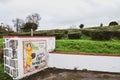 Maia, Azores, Portugal - Jan 14, 2020: Gorreana Tea Plantation in Sao Miguel Island. Rows of tea bushes on a hill. Overcast sky. Royalty Free Stock Photo