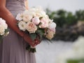 Maid of honor holding Brides bouquet Royalty Free Stock Photo