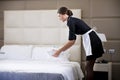 Maid Making Bed