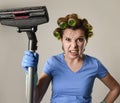 Maid service woman or upset housewife in hair rollers cleaning g