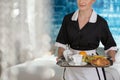 Maid with tray with fruit Royalty Free Stock Photo