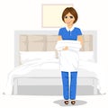 Maid woman with towels and bed sheets. House cleaning service concept Royalty Free Stock Photo