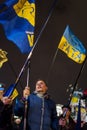 Maidan - young activist with flag of nationalistic party svoboda on independence square