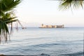 Maiden`s castle, Kiz Kalesi with palm in Mediterranean Sea. Mersin Turkey Royalty Free Stock Photo